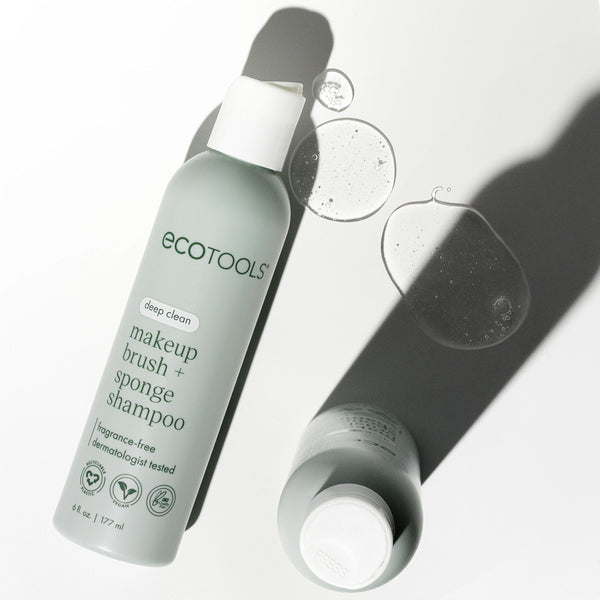 ECOTOOLS makeup brush and sponge shampoo bottle with small water droplets