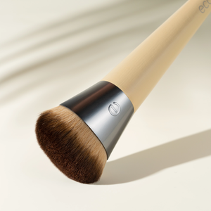 Complexion foundation brush with soft brown bristles and beige handle