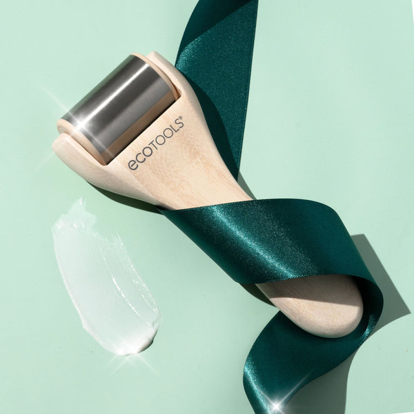 Ecotools ice roller with stainless steel cylinder and light wood handle, angled