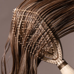 Fine hair detangler paddle brush detangling thick strands of dark brown hair