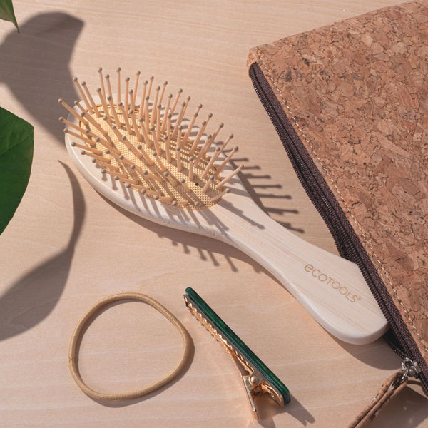Mini detangler hair brush with oval pin head and bamboo handle