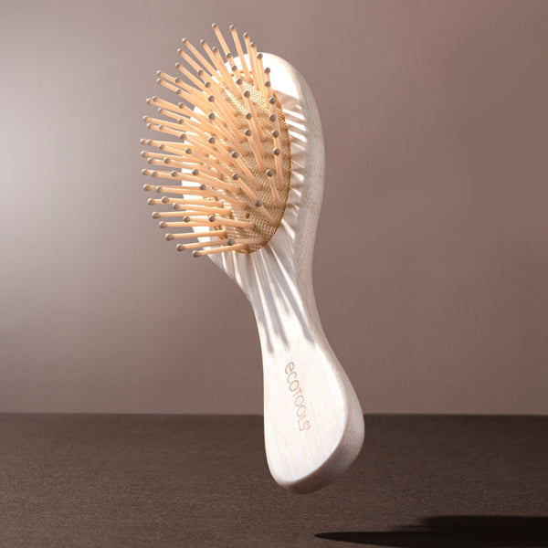 Mini detangler hair brush with bamboo handle and oval pin brush head