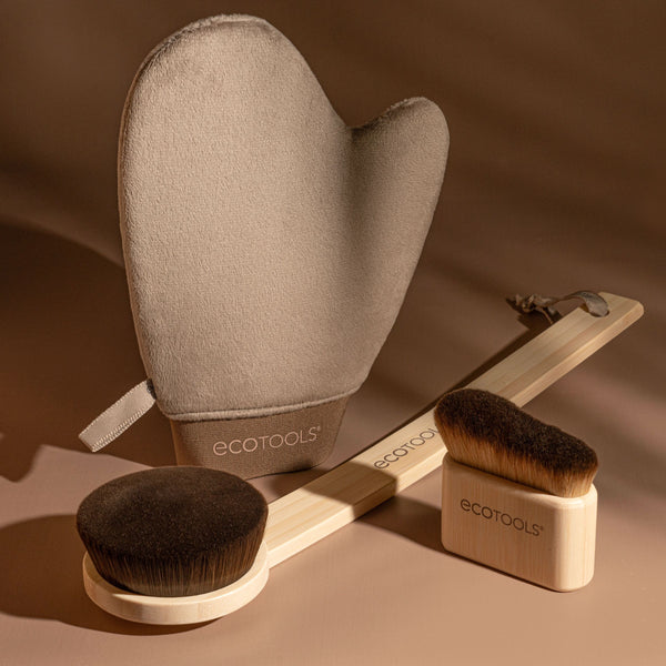 Beige tanning mitt with terry fabric cuff laid flat on a set