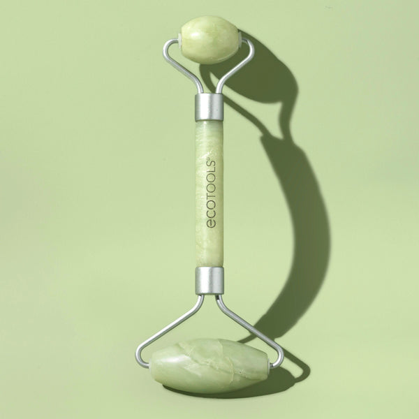 Pale green jade facial roller with curved stainless handles and two stone rollers