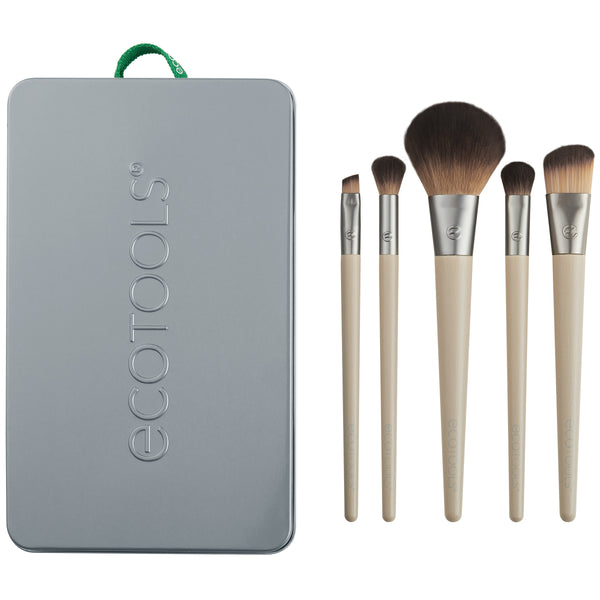 Makeup brush kit: five brushes with beige handles and brown bristles beside gray tin case