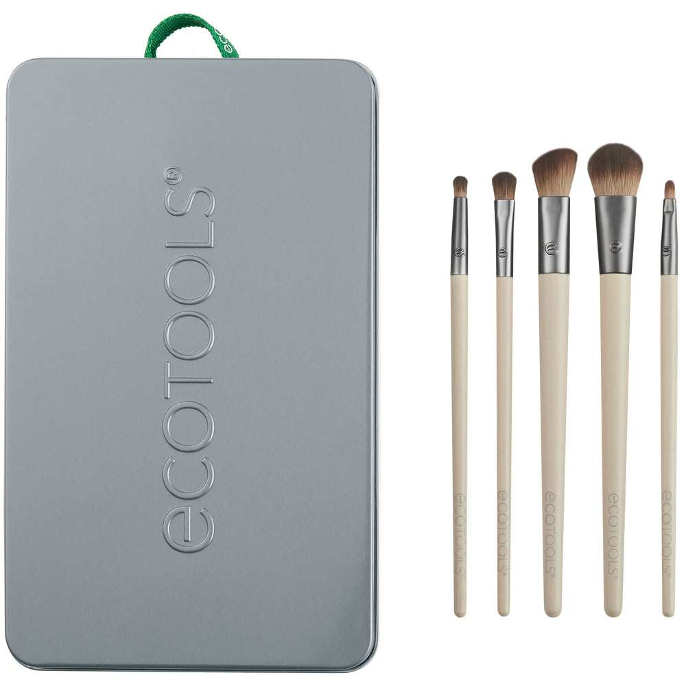 Eye makeup brush set with embossed metal tin and five beige-handled brushes