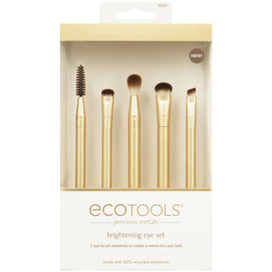Boxed brightening eye brush set with five gold brushes and dark brown bristles.