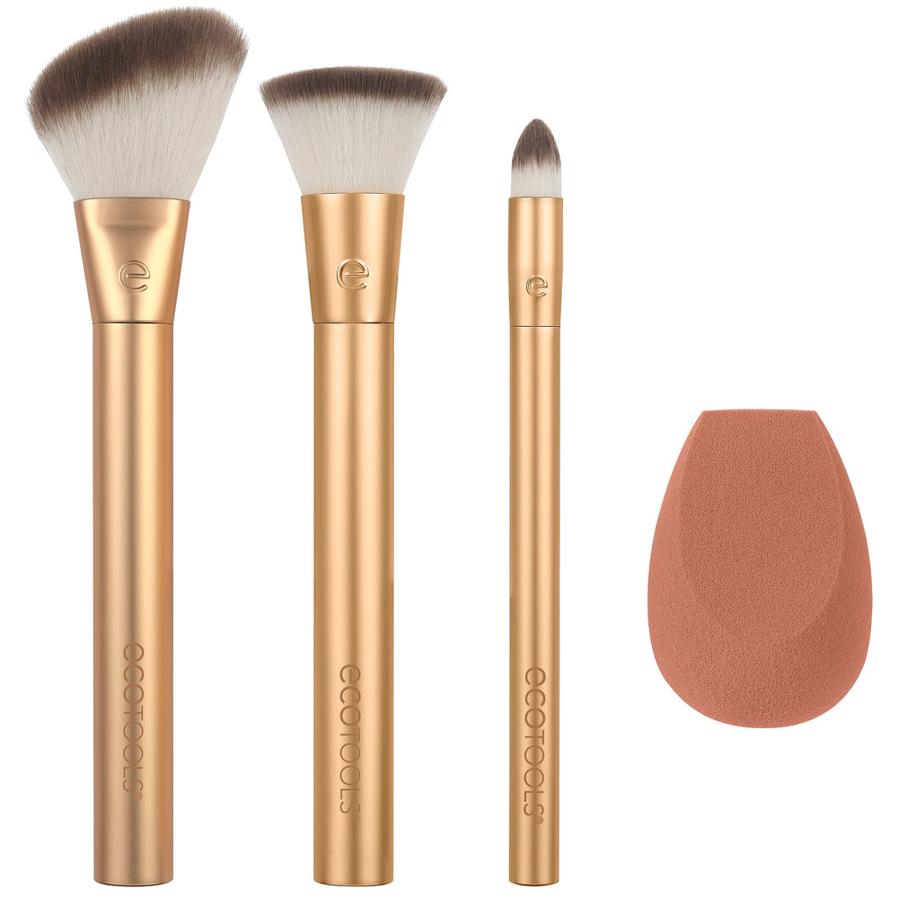 Makeup brush set with three gold brushes and a teardrop blending sponge.