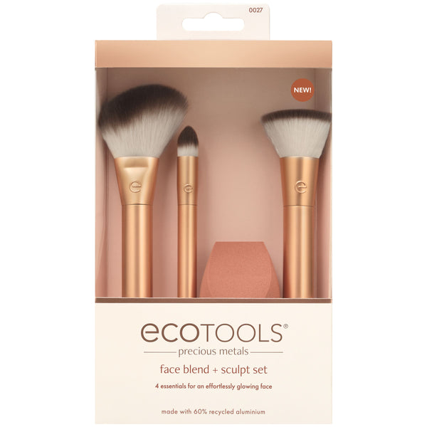 Boxed makeup brush set showing three brushes and teardrop blending sponge inside.
