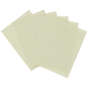 Facial blotting papers, pale green sheets stacked in overlapping layers