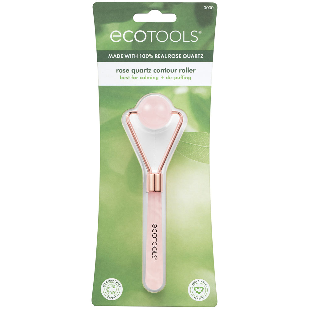 Rose quartz facial roller with round pink stone head and rose-gold metal frame, pink handle