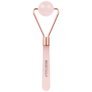 Rose quartz facial roller with round pink stone head and rose-gold metal frame, pink handle