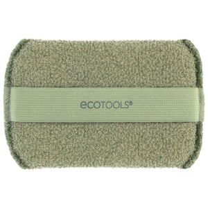 Olive-green exfoliating body buffer with light-green loop strap across the back