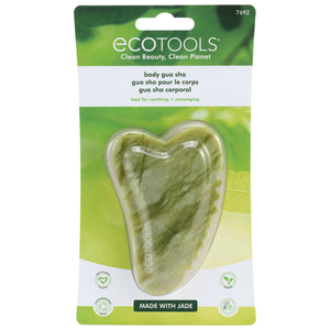 Jade gua sha stone tool in retail blister pack, heart-shaped with scalloped edge