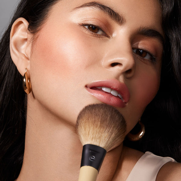 Makeup brush from EcoTools core five set in use on cheek with soft brown bristles