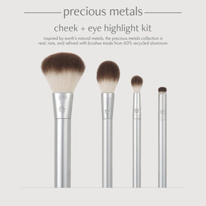 Cheek and eye highlight kit with four silver-handled brushes and brown tapered bristles