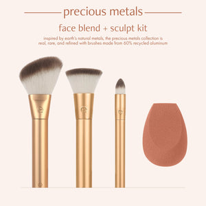 Makeup brush set box front with three gold brushes and teardrop blending sponge.