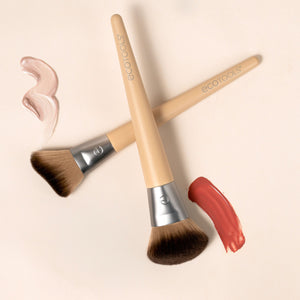 Two makeup brushes with beige handles and soft brown bristles for blush and highlighting