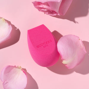 Pink teardrop makeup sponge with rounded tip and flat base