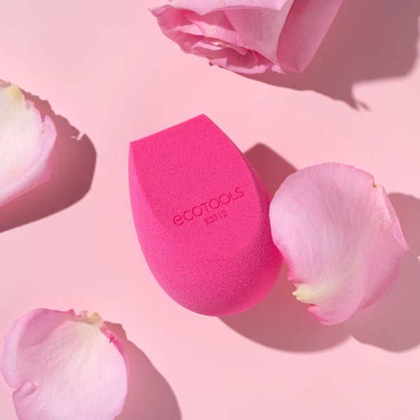 Pink teardrop makeup sponge with rounded tip and flat base