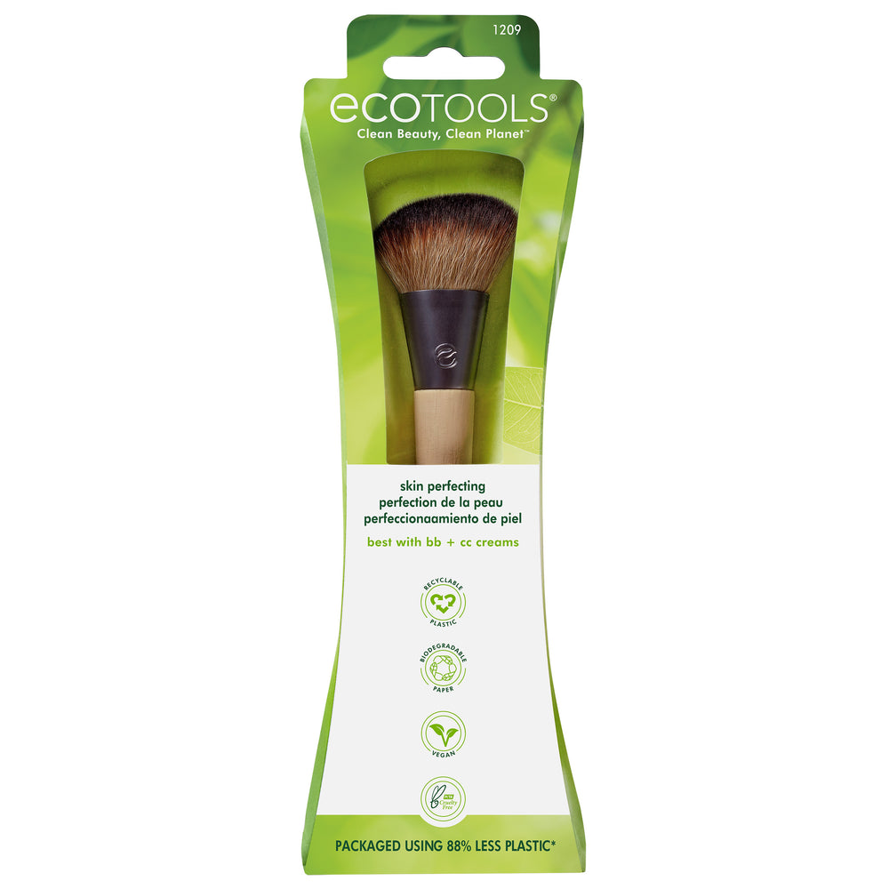Skin perfecting makeup brush with dark dome-shaped bristles and bamboo handle