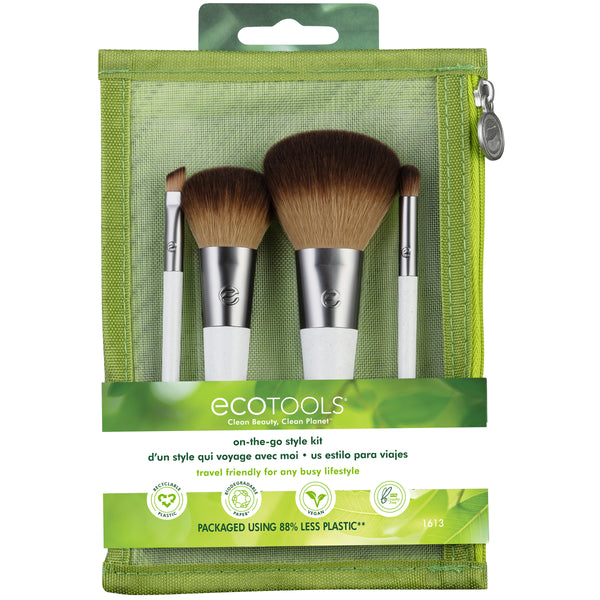 Travel makeup brush kit with green zip pouch and 4 brushes with brown bristles.