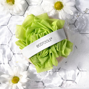 Green cleansing pouf pad with white band and ECOTOOLS logo, loofah-like texture