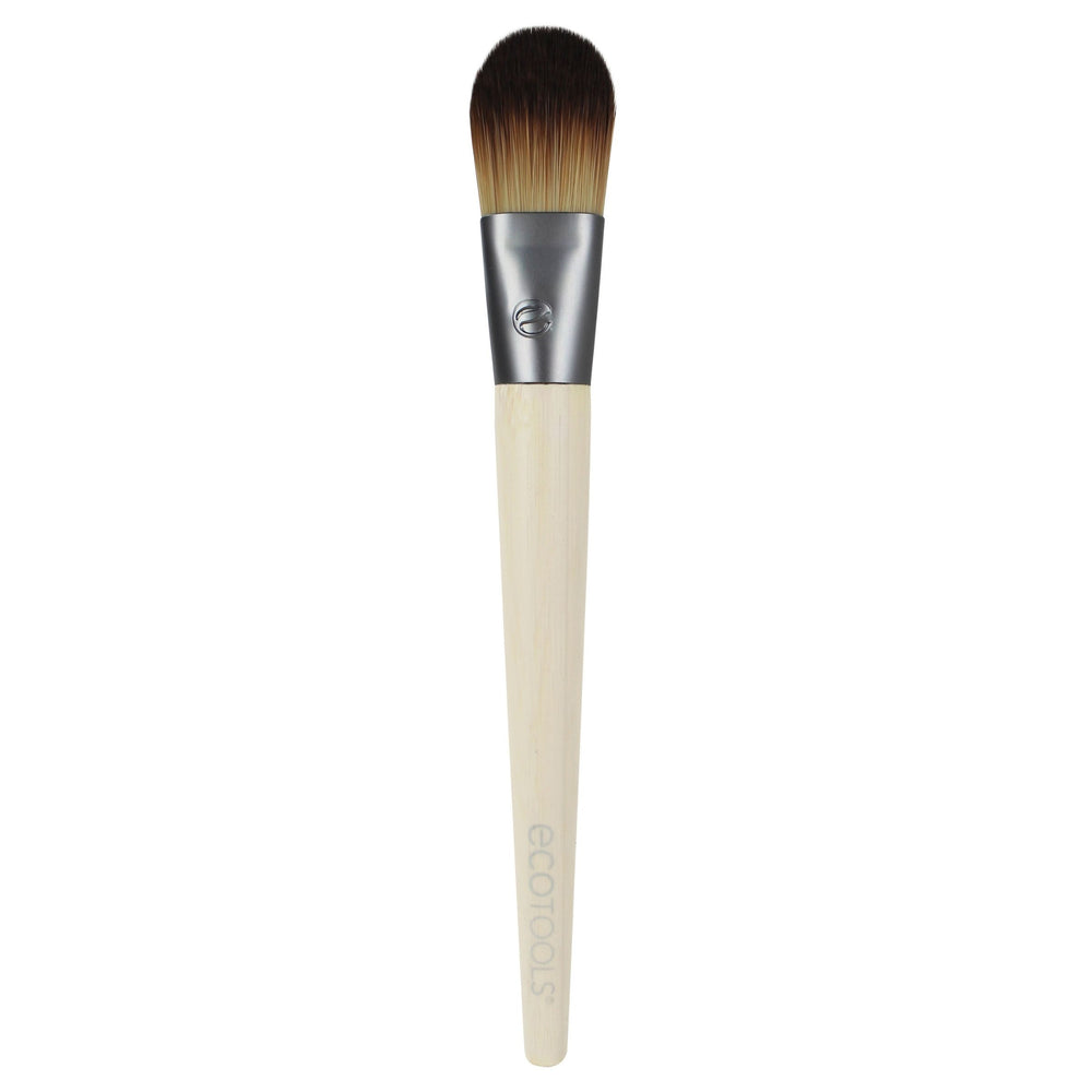 Foundation makeup brush with dark bristles and light bamboo handle
