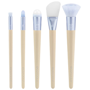 Skincare brush kit with five blue-and-cream handles and soft white bristles.
