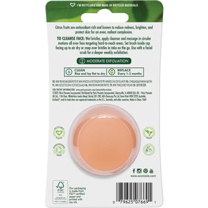 Mini cleansing brush blister back view with circular orange scrub head and bristles