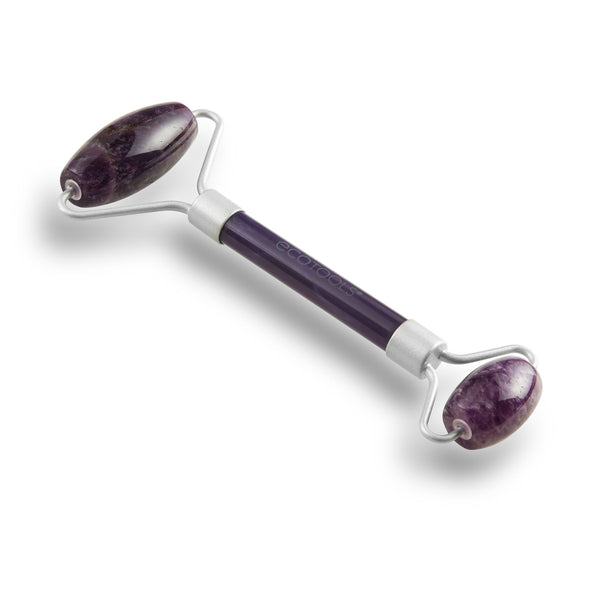Amethyst facial roller with purple oval stone heads on a curved silver handle