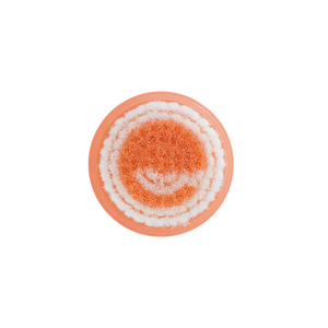 Circular mini cleansing brush head with orange scrub center and white bristles