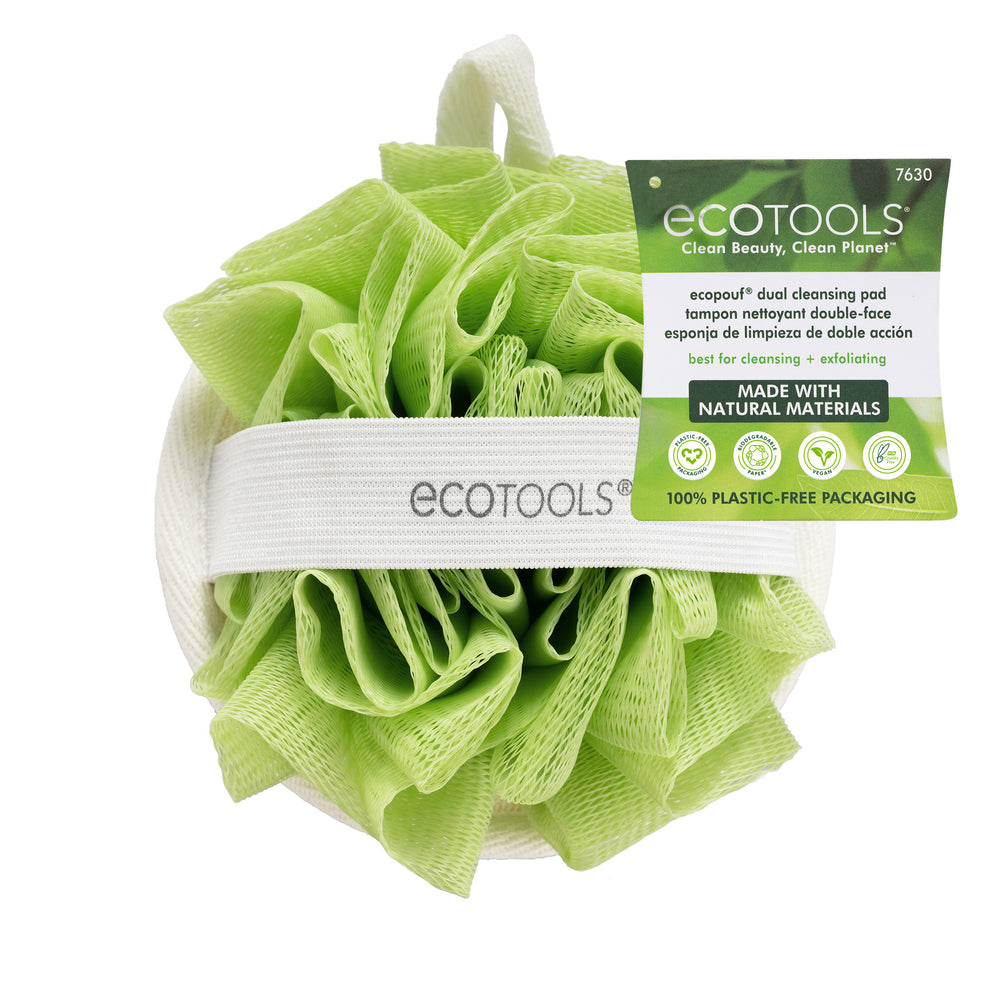 Green dual-sided cleansing pad with white loop handle, exfoliating loofah texture