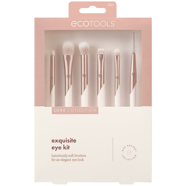 Boxed eye makeup brush kit showing seven rose-gold brushes with white bristles