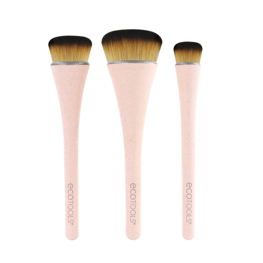 Makeup brush set with three tapered brushes, pink handles and golden bristles