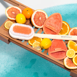 Bath brush with wooden handle, orange bristle pad and white bristle side