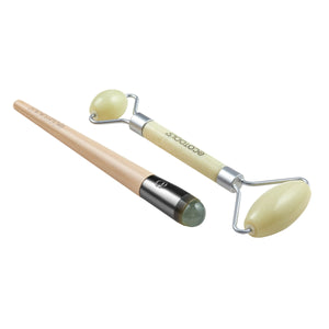 Jade roller duo with two curved pale-green stones, silver frames, and light wood handles