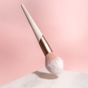Plush powder makeup brush angled, soft white bristles with rose and cream handle