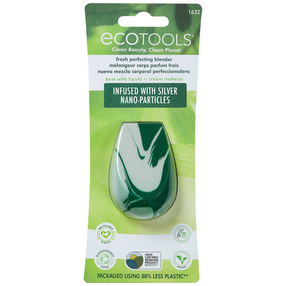 Teardrop blending sponge with white foam and green swirled pattern on surface.