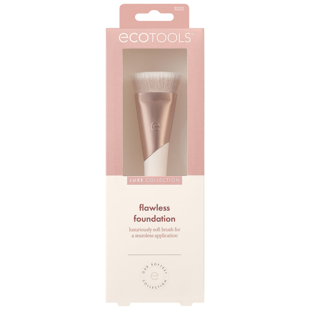 Foundation makeup brush with soft light beige bristles and rose-gold handle