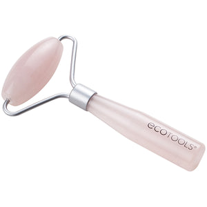 Mini rose quartz facial roller, pink stone head on a light pink handle with metal frame.