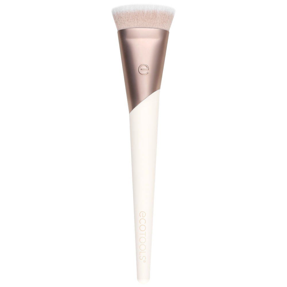 Foundation makeup brush with soft light beige bristles and rose-gold handle
