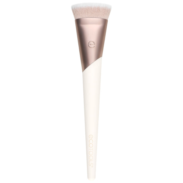 Foundation makeup brush with soft light beige bristles and rose-gold handle