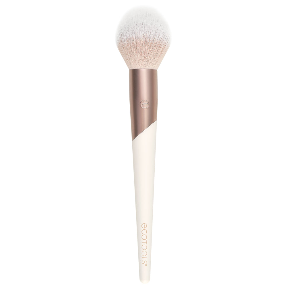 Plush powder makeup brush with soft white bristles and rose-and-cream handle