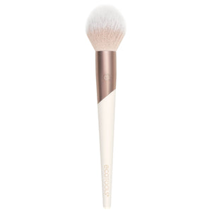 Plush powder makeup brush with soft white bristles and rose-and-cream handle