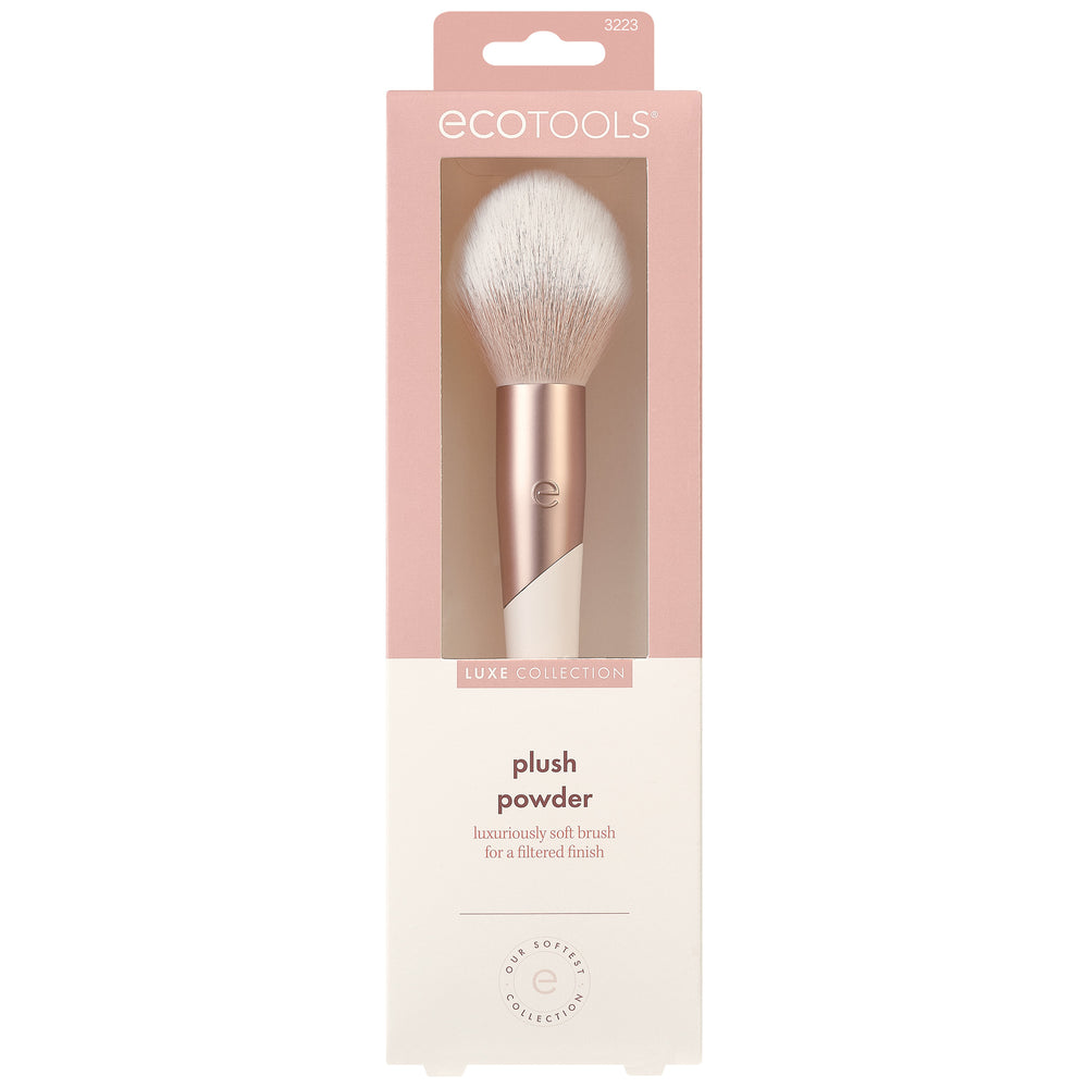 Plush powder makeup brush with soft white bristles and rose-and-cream handle