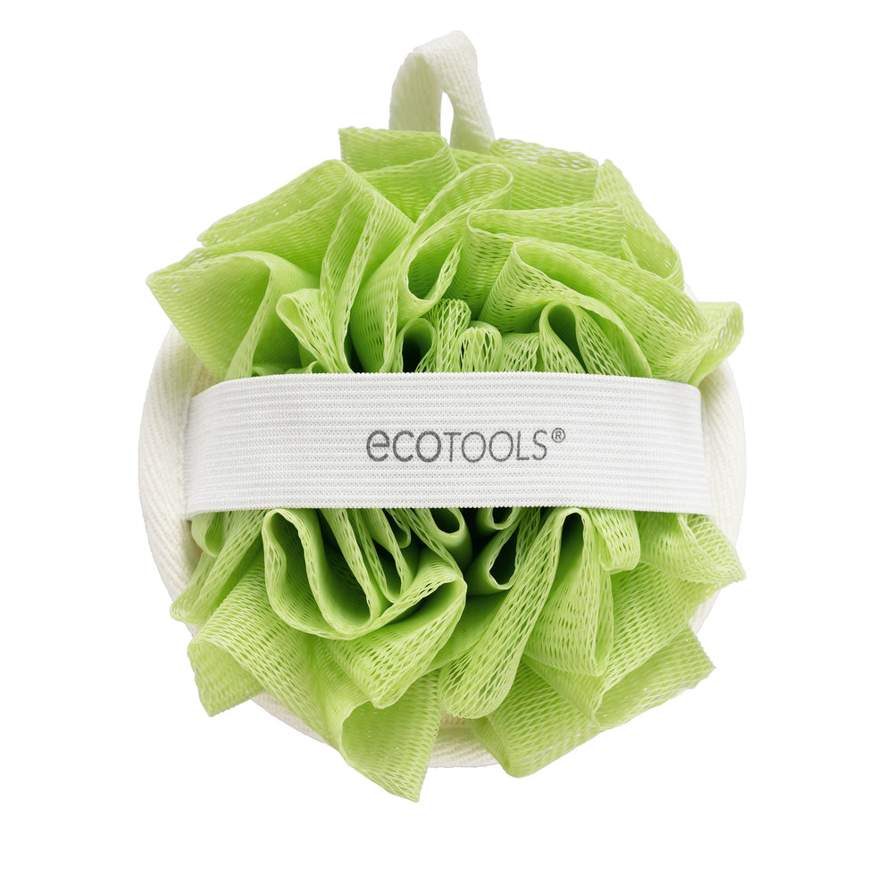 Green dual-sided cleansing pad with white loop handle, exfoliating loofah texture