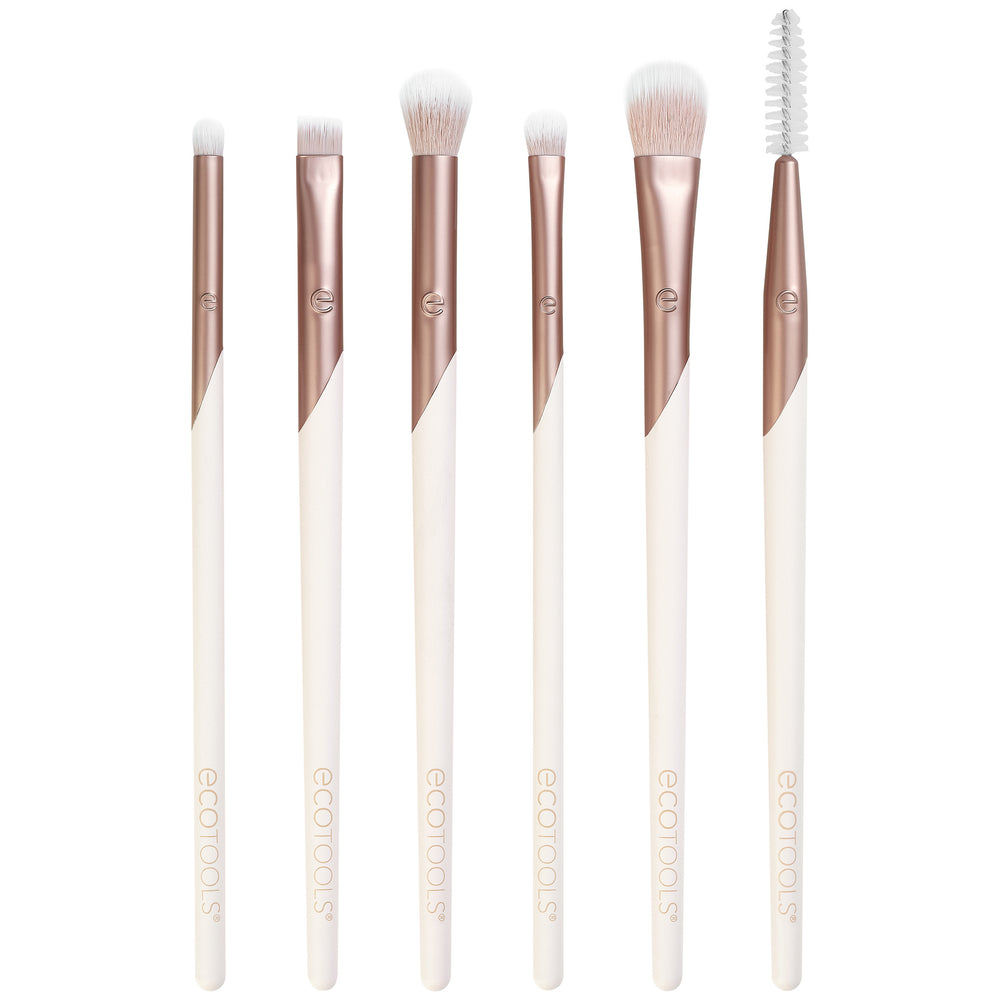 Eye brush set with rose-gold handles and white bristles, including spoolie brush