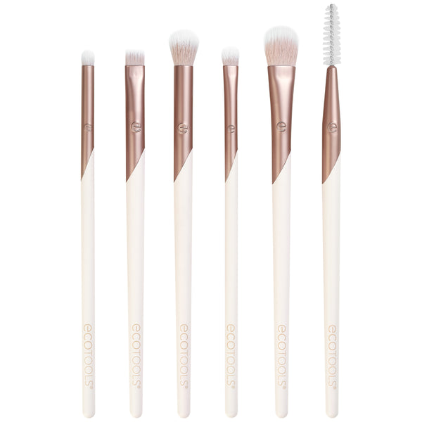 Eye brush set with rose-gold handles and white bristles, including spoolie brush